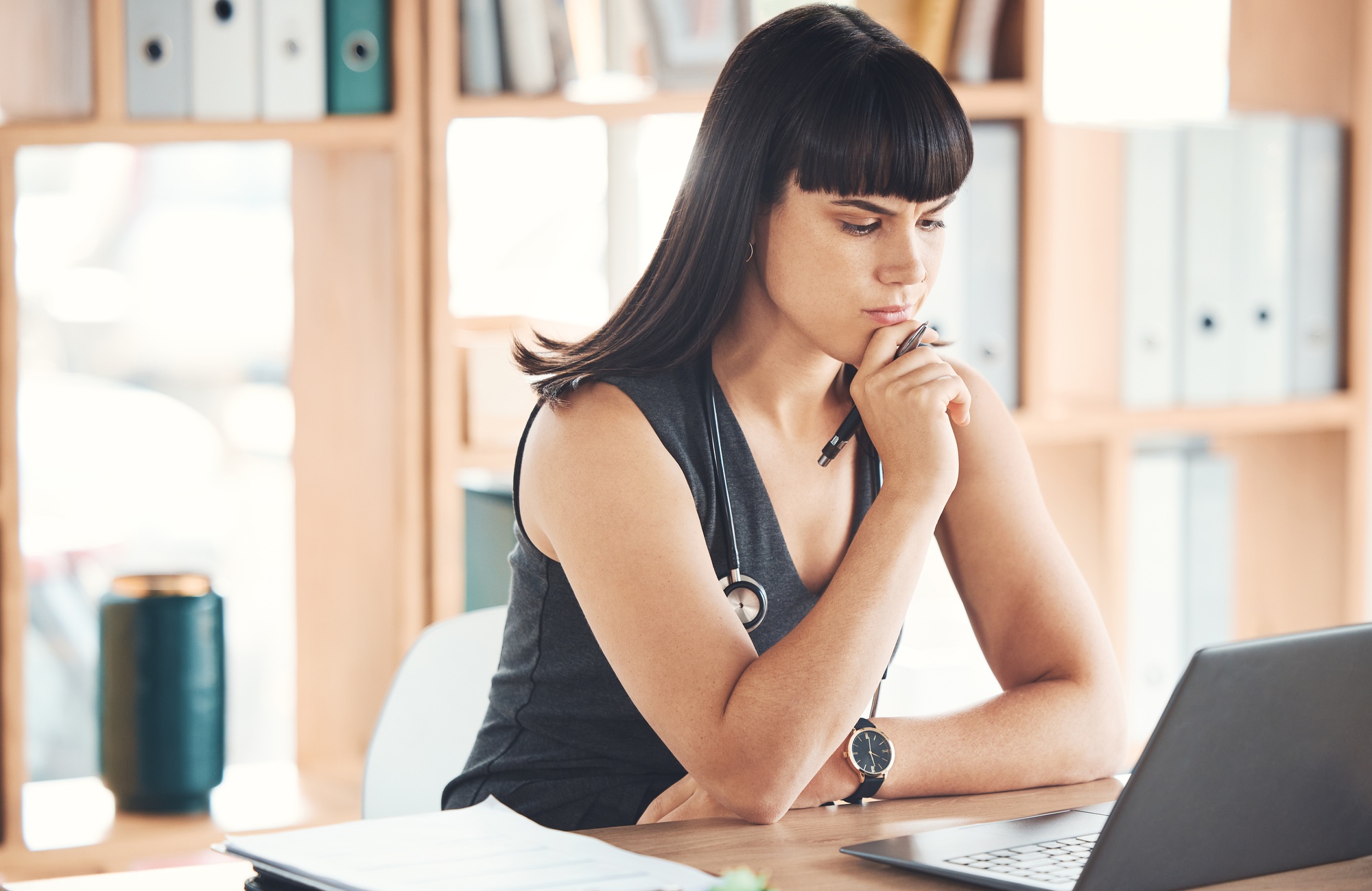 Laptop, thinking and business woman in office looking for solution to problem. Ideas, computer and