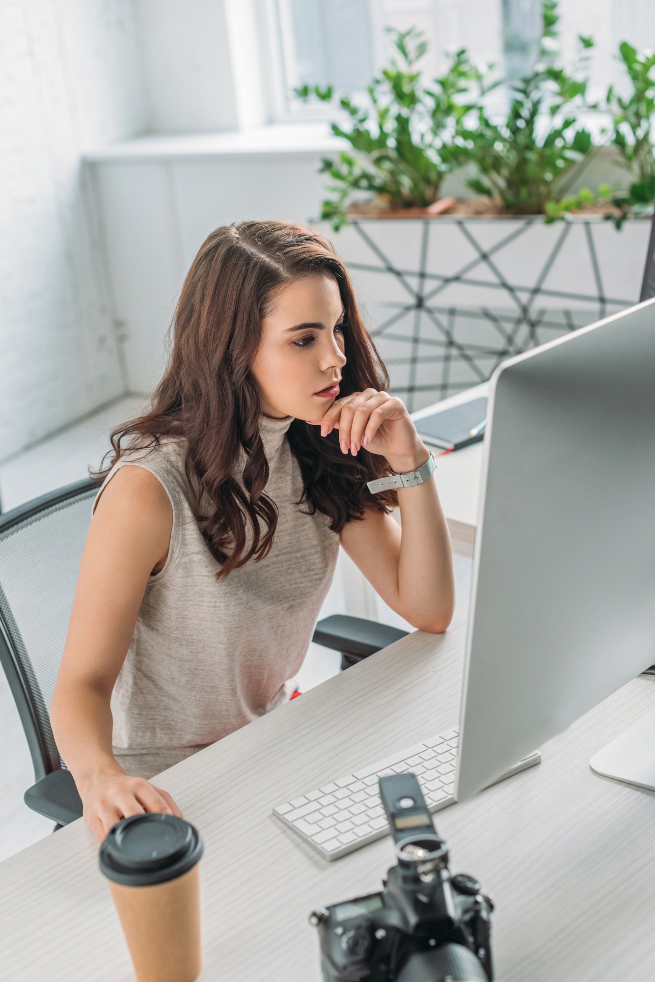 selective focus of attractive art editor looking at computer monitor